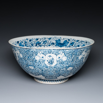 A very fine and rare Dutch Delft blue and white bowl with grotesques in the style of Daniel Marot, dated 1720