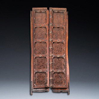 A pair of reticulated wooden doors with geometrical patterns, Northern Africa, 19th C.