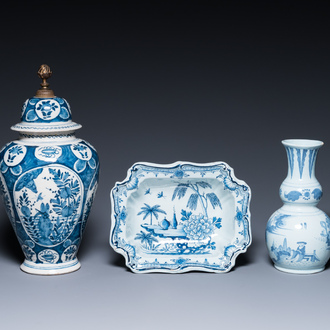 Two Dutch Delft blue and white chinoiserie vases and a deep salad bowl, 17/18th C.