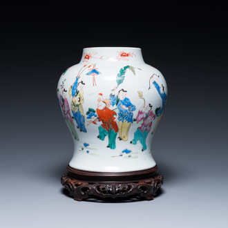 A Chinese famille rose 'playing boys' vase on a fine carved wooden stand, Yongzheng