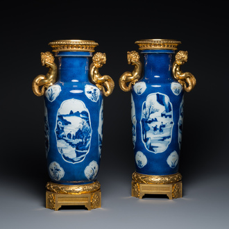 A pair of Chinese blue, white and copper-red powder blue-ground rouleau vases with fine gilt bronze mounts, Kangxi and 19th C.