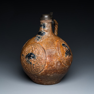 A large pewter-lidded armorial stoneware bellarmine jug with portrait medallions, Frechen, Germany, dated 1603 and 1605