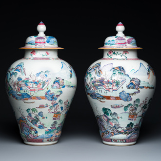 A pair of Chinese famille rose vases and covers with mountainous river landscapes, Yongzheng