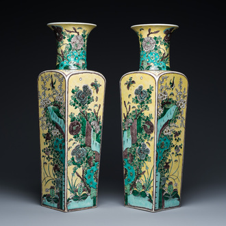 A pair of Chinese square yellow-ground famille verte vases, Kangxi mark, 19th C.