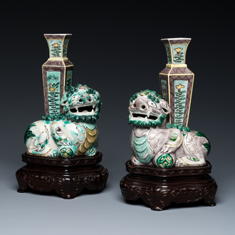 A pair of Chinese verte biscuit vases resting on Buddhist lions, Kangxi