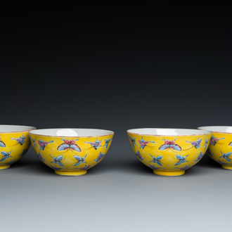 Four Chinese famille rose yellow-ground 'butterfly' bowls, Tongzhi mark and of the period