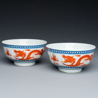 A pair of Chinese blue, white and iron-red 'dragon' bowls, Xuantong mark and of the period