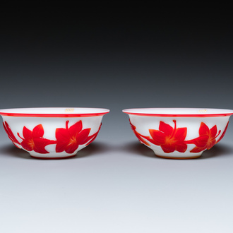 A pair of Chinese overlay Beijing glass bowls with floral design in red on white, 19th C.
