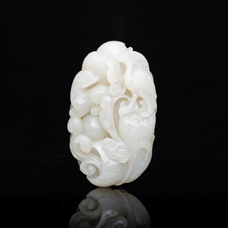 A Chinese white jade paper weight with a crane and a tiger, 17/18th C.