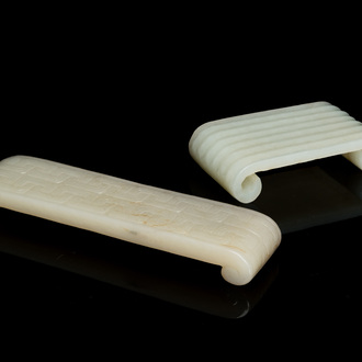 Two fine Chinese white and celadon jade brush rests, Qing