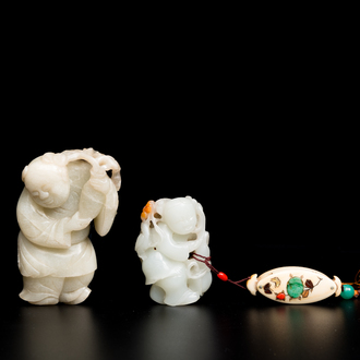 Two Chinese white and celadon jade carved standing boys, Qing