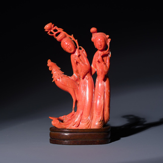 A Chinese red coral group of two ladies and a phoenix, 19/20th C.