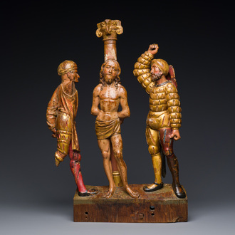 A Flemish polychromed and gilded wood retable fragment with 'The flagellation of Christ', probably Antwerp, early 16th C.