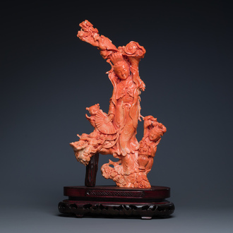 A large Chinese red coral group of a lady holding a cornucopia surrounded by children, 19/20th C.