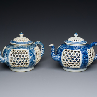 A pair of Chinese reticulated and double-walled blue and white teapots, Transitional period