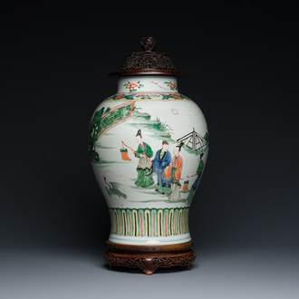 A Chinese famille verte vase with reticulated wooden cover and stand, Kangxi