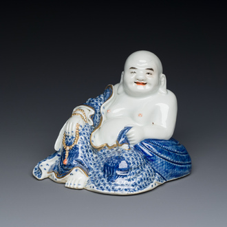 A Chinese blue and white seated Buddha, You Lin Ji Zao 游林記造 mark, Republic