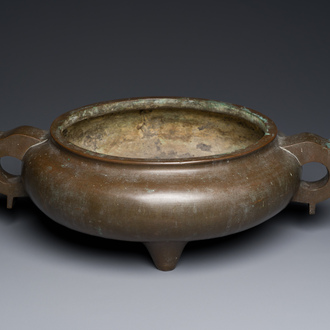 A very large Chinese bronze tripod censer, sixteen-character Xuande mark, 17/18th C.