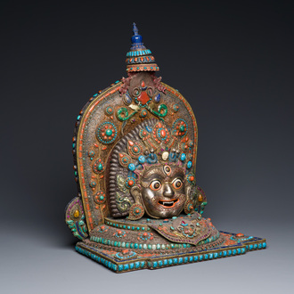 A fine large semi-precious-stone-inlaid filigree silver 'Bhairava' mask, Tibet or Nepal, 19th C.