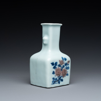 A small Chinese celadon-ground blue, white and copper-red bottle vase, Qianlong mark and of the period