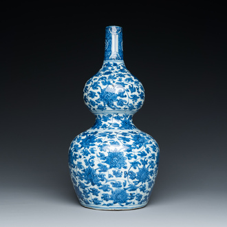 A Chinese blue and white 'lotus scroll' double gourd vase, Jiajing/Wanli