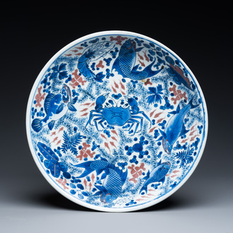 A Chinese blue, white and copper red 'crab and fish' dish, Kangxi