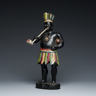 An English polychromed wood sculpture of a pipe-smoking Indian from a tobacco store, 18th C.