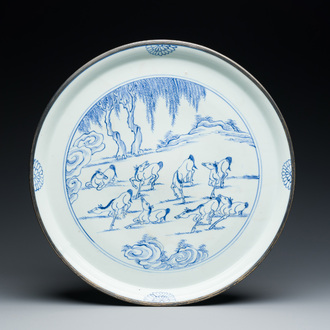 A Chinese blue and white 'Eight horses of Mu Wang' dish with silver-mounted rim, Kangxi/Yongzheng