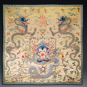 A large Chinese yellow-ground silk embroidery decorated with three five-clawed dragons, 19th C.