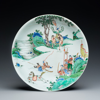 A Chinese famille verte dish with a rider falling from his horse, Chenghua mark, Kangxi