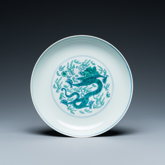 A Chinese doucai green-enamelled 'dragon' dish, Kangxi mark and probably of the period