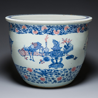 An exceptional massive Chinese blue, white and copper-red fish bowl with antiquities and 'Master of the rocks'-style panels, Kangxi