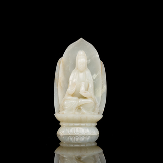 A Chinese white jade sculpture of Guanyin on a lotus throne, Qing
