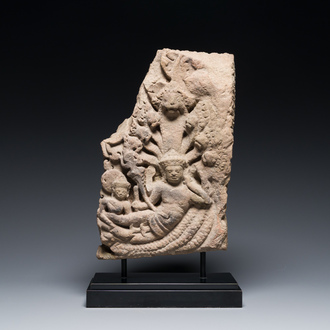 A fine Khmer sandstone relief depicting 'The birth of Brahma', Angkor period, Cambodia, 11th C.