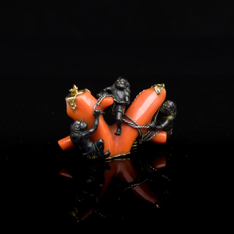 A rare Japanese gold and silver pendant with three South Sea-islanders on a coral branch, Meiji, 19th C.