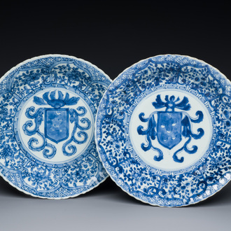 A pair of Chinese blue and white plates with the arms of the De Pinto family for the Portuguese market, Kangxi