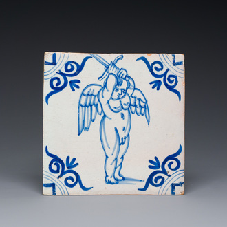 A rare Dutch Delft blue and white tile with a large cherub holding a sword, 1st half 17th C.