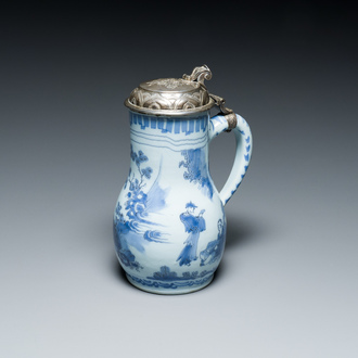 A Dutch Delft blue and white chinoiserie jug with silver lid, 17th C.