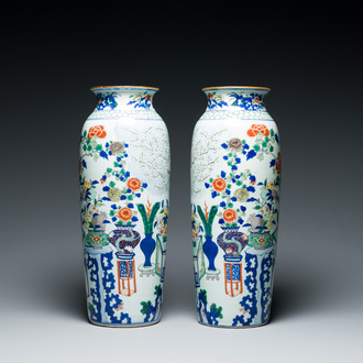 A pair of Chinese wucai rouleau vases, 19/20th C.