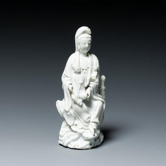 A Chinese Dehua blanc de Chine figure of Guanyin with a boy, Kangxi/Qianlong