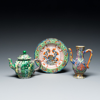 A Chinese clobbered blue and white ewer, a plate and a verte biscuit teapot, Kangxi