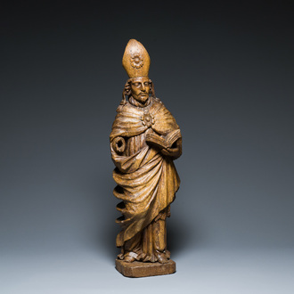 A large Flemish oak sculpture of a saint, 16th C.