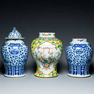 Three Chinese blue, white and famille verte vases, 19th C.