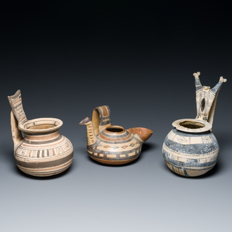 Two geometrical decorated Daunian pottery vessels and an olive press, Southern Italy, 6th/3rd C. b.C.