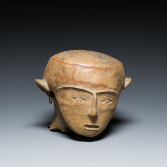 A terracotta lid fragment in the shape of a head, Southeast Asia, probably 19th C.