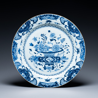 A large Chinese blue and white dish with a basket of flowers, Qianlong