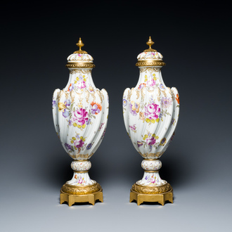 A pair of polychrome Höchst porcelain vases with gilt-bronze mounts, Germany, 19th C.