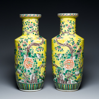 A pair of Chinese yellow-ground famille verte rouleau vases, 19th C.