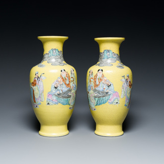 A pair of Chinese famille rose yellow sgraffiato ground 'sages' vases, Qianlong mark, Republic