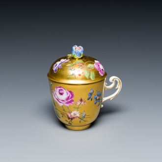 A polychrome gilt-ground Meissen porcelain cup and cover, Germany, 18th C.
